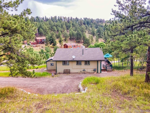 162 Pine Trl, Bailey, CO 80421 - rear view of house with a wooded view
