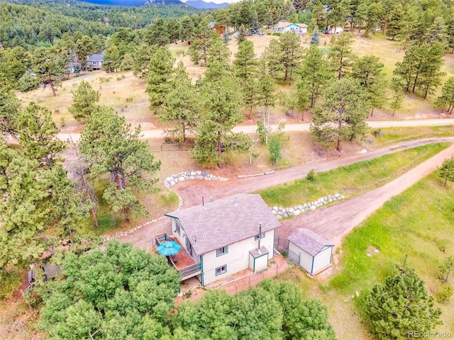 162 Pine Trl, Bailey, CO 80421 - aerial view of property and surrounding area featuring a heavily wooded area and mountains
