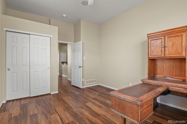 unfurnished office featuring dark hardwood / wood-style flooring