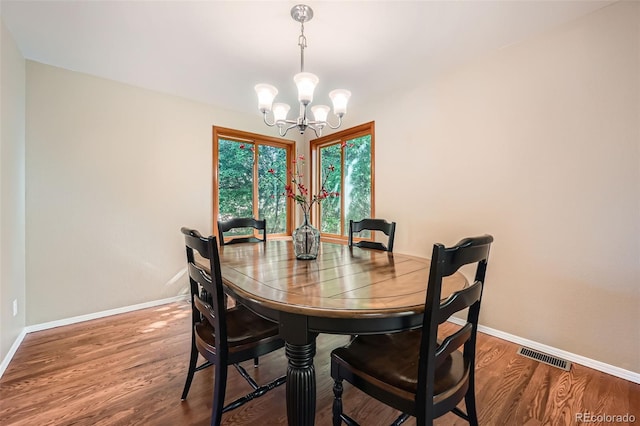 360 Morning Star Ln, Lafayette, CO 80026 - dining room featuring a chandelier and wood finished floors