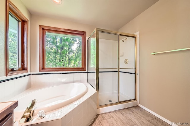 360 Morning Star Ln, Lafayette, CO 80026 - bathroom featuring a garden tub, a shower stall, and vanity