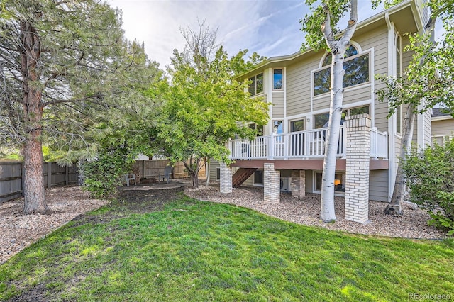 360 Morning Star Ln, Lafayette, CO 80026 - fenced backyard featuring a deck and stairway