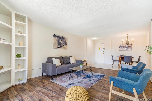 2231 S Vaughn Way Unit 317B, Aurora, CO 80014 - living area with wood finished floors, a chandelier, and a textured ceiling