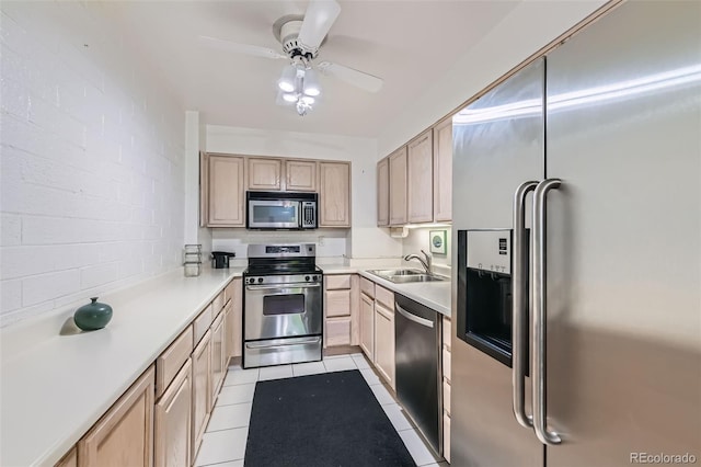 460 S Marion Pkwy Unit 102, Denver, CO 80209 - kitchen featuring appliances with stainless steel finishes, light brown cabinets, ceiling fan, light countertops, and light tile patterned floors