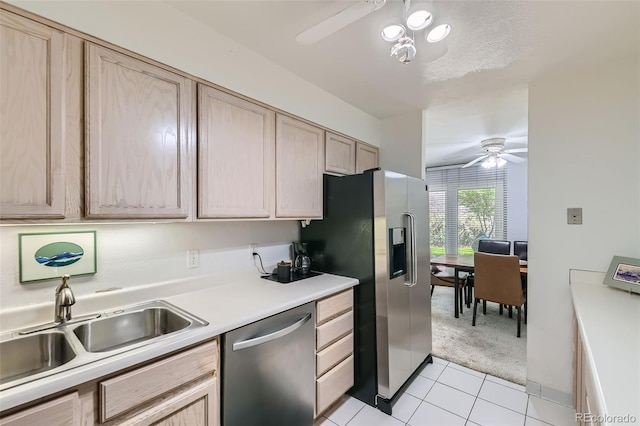 460 S Marion Pkwy Unit 102, Denver, CO 80209 - kitchen featuring appliances with stainless steel finishes, ceiling fan, light brown cabinetry, and light carpet