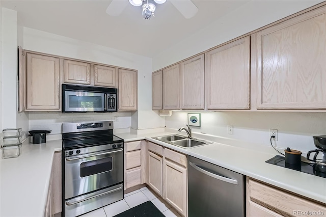 460 S Marion Pkwy Unit 102, Denver, CO 80209 - kitchen featuring stainless steel appliances, light brown cabinetry, and light countertops