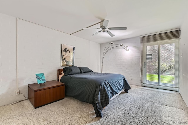 460 S Marion Pkwy Unit 102, Denver, CO 80209 - bedroom featuring access to exterior, a ceiling fan, and concrete block wall