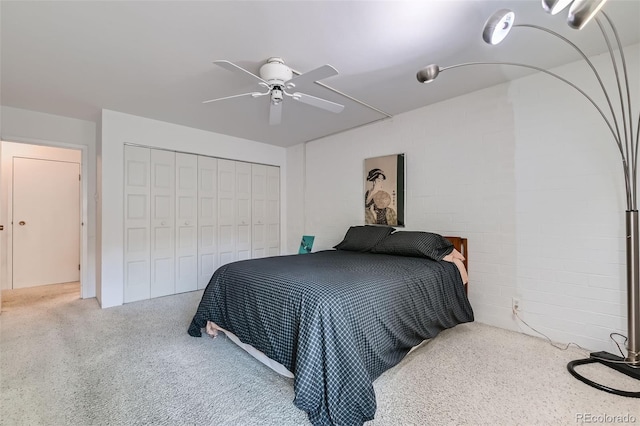 460 S Marion Pkwy Unit 102, Denver, CO 80209 - carpeted bedroom with a closet, concrete block wall, and a ceiling fan