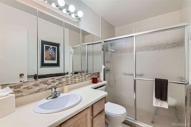 460 S Marion Pkwy Unit 102, Denver, CO 80209 - full bathroom with vanity, a shower stall, and tasteful backsplash