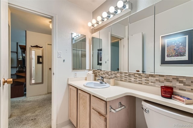 460 S Marion Pkwy Unit 102, Denver, CO 80209 - bathroom with decorative backsplash and vanity