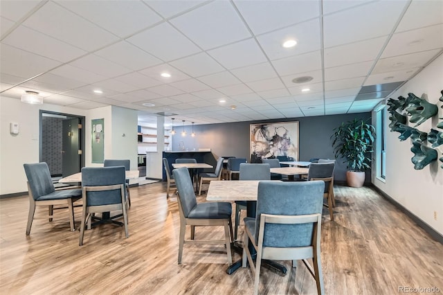 460 S Marion Pkwy Unit 102, Denver, CO 80209 - dining space with light wood finished floors and a drop ceiling