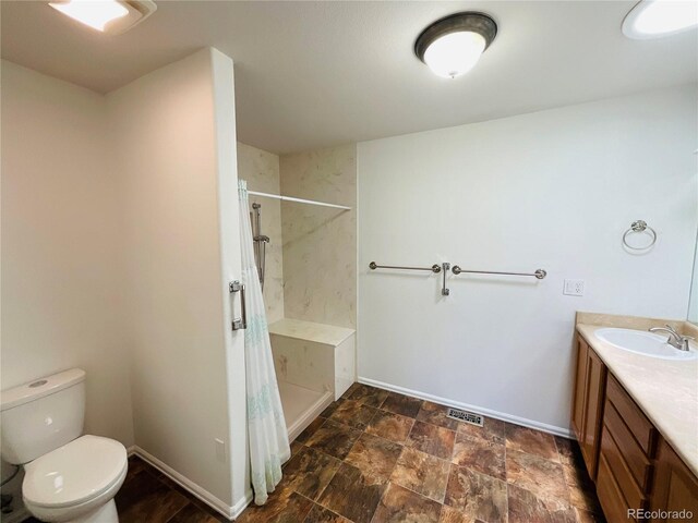 bathroom featuring vanity, toilet, tile patterned floors, and a shower with shower curtain