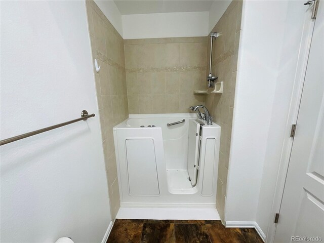 laundry area with dark hardwood / wood-style floors