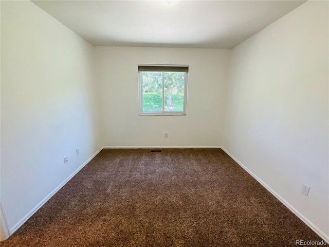 spare room with carpet floors