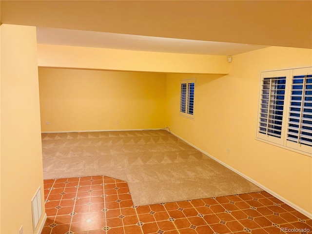 basement with carpet flooring