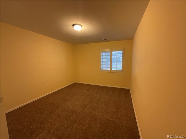 unfurnished room featuring carpet