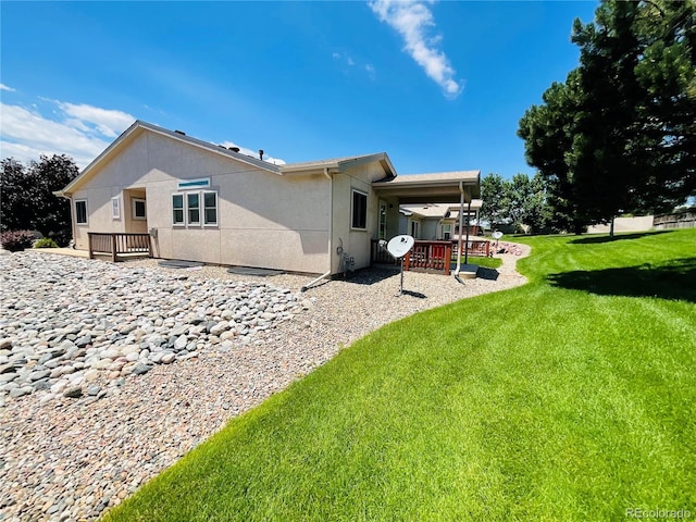 rear view of property with a lawn