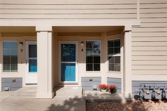 property entrance featuring covered porch