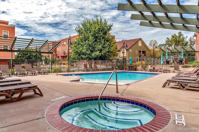 community pool with fence, a community hot tub, a pergola, and a patio