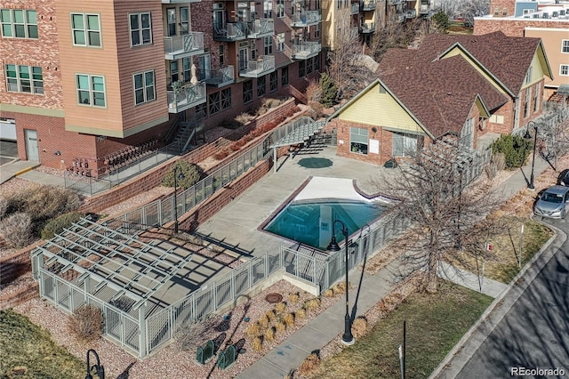 community pool featuring fence