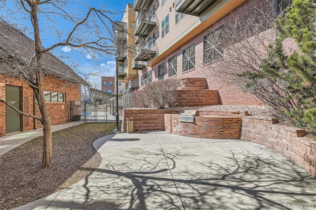 view of patio / terrace with a gate, fence, and area for grilling