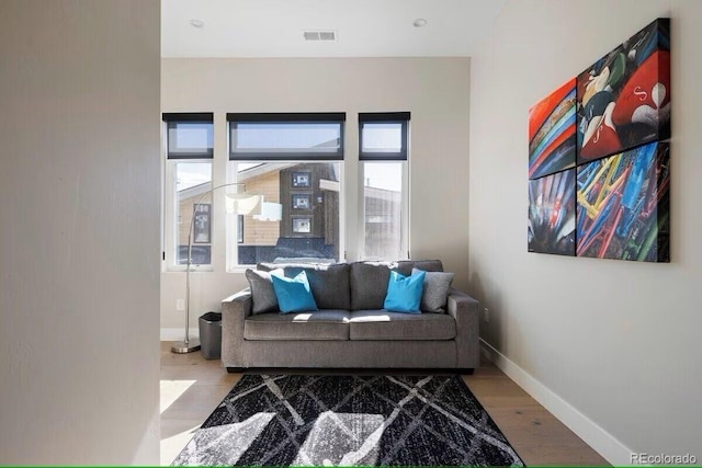 387 Bear Trl, Winter Park, CO 80482 - living area with plenty of natural light, baseboards, and wood finished floors