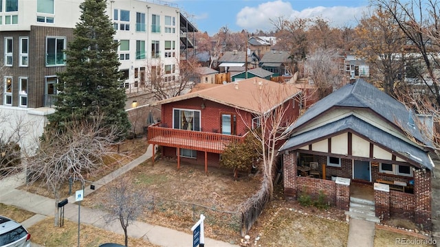 exterior space with brick siding, a residential view, and a porch