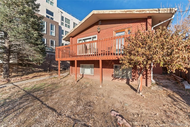 back of house with brick siding