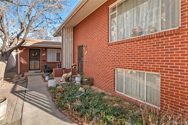 entrance to property with brick siding