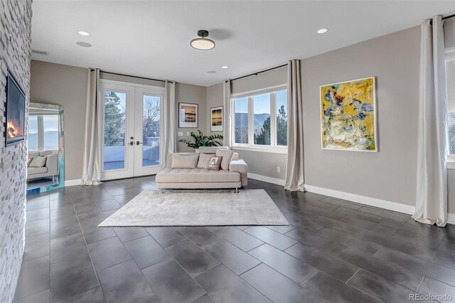 15902 W 64th Ave, Arvada, CO 80007 - living area with french doors, baseboards, and recessed lighting