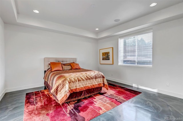 15902 W 64th Ave, Arvada, CO 80007 - bedroom with a tray ceiling, finished concrete floors, recessed lighting, and baseboards