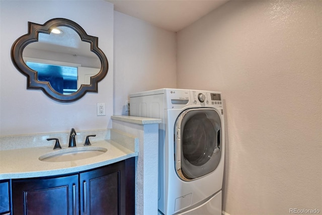 washroom featuring washer / clothes dryer and sink