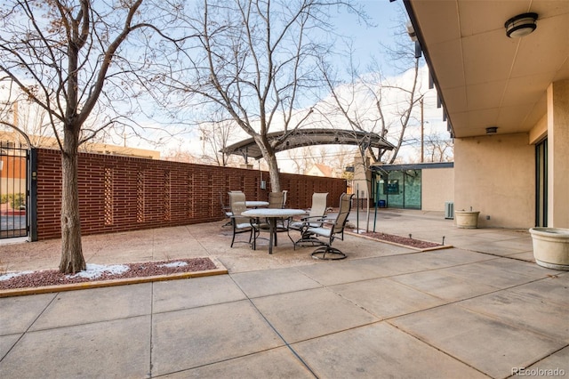 view of patio terrace at dusk