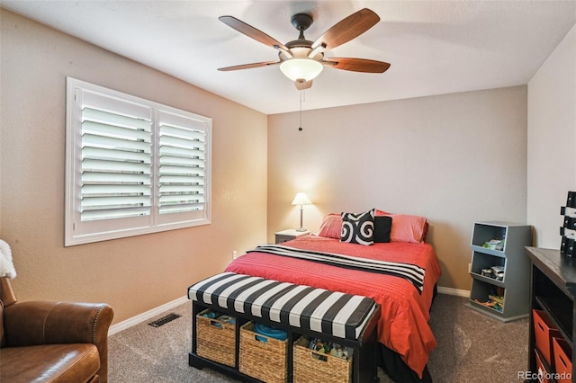 carpeted bedroom featuring baseboards and a ceiling fan