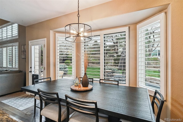 14417 W 57th Pl, Arvada, CO 80002 - dining area with a chandelier and wood finished floors