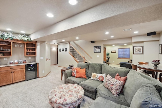 14417 W 57th Pl, Arvada, CO 80002 - living area featuring wet bar, light colored carpet, stairs, recessed lighting, and baseboards
