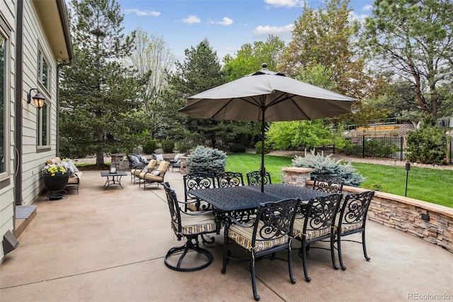 14417 W 57th Pl, Arvada, CO 80002 - view of patio featuring outdoor dining area and view of wooded area