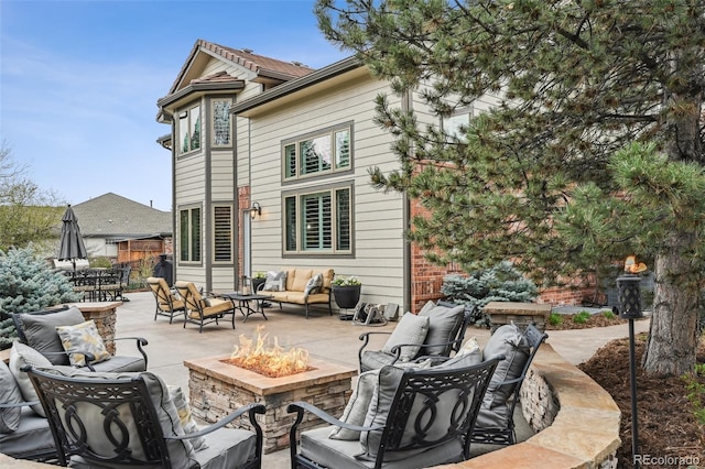 14417 W 57th Pl, Arvada, CO 80002 - back of house featuring an outdoor living space with a fire pit and a patio area