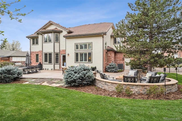 14417 W 57th Pl, Arvada, CO 80002 - back of house featuring a patio and an outdoor hangout area