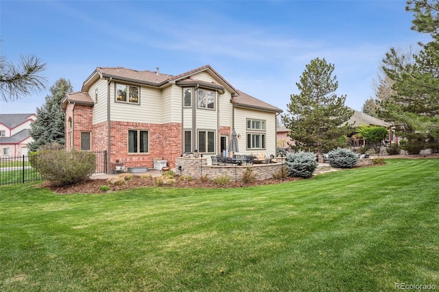 14417 W 57th Pl, Arvada, CO 80002 - back of property featuring a patio area and brick siding