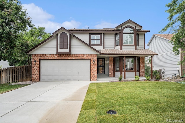 17548 E Wesley Pl, Aurora, CO 80013 - view of front of property featuring covered porch, brick siding, concrete driveway, and roof with shingles