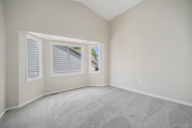 17548 E Wesley Pl, Aurora, CO 80013 - carpeted spare room featuring vaulted ceiling and baseboards