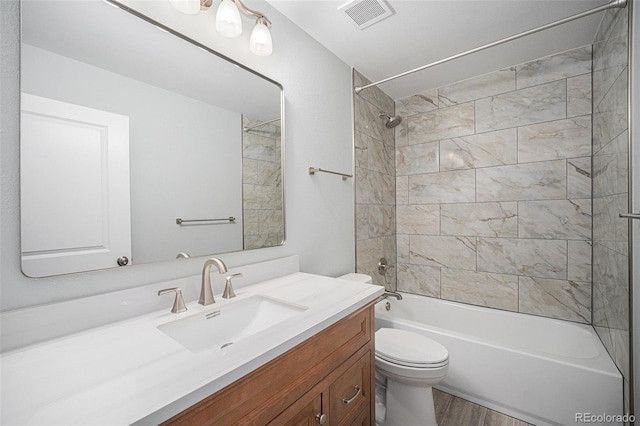 17548 E Wesley Pl, Aurora, CO 80013 - bathroom featuring vanity, tub / shower combination, and wood finished floors
