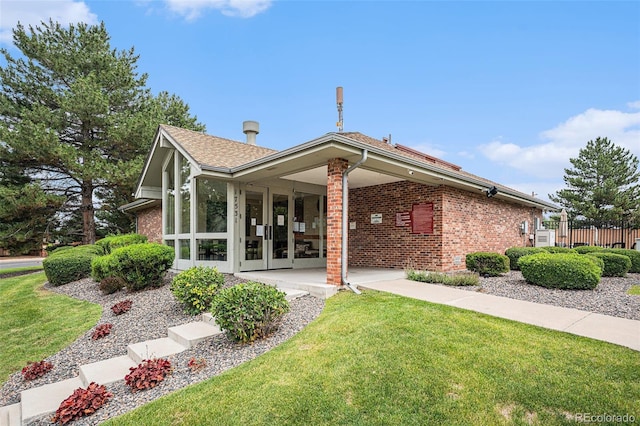 17548 E Wesley Pl, Aurora, CO 80013 - rear view of house with brick siding