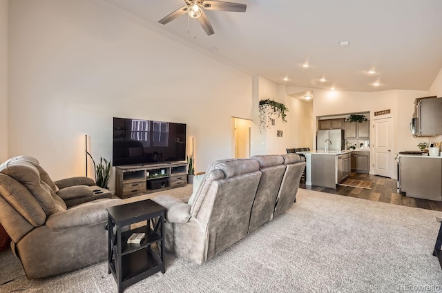 living room with vaulted ceiling, dark hardwood / wood-style floors, and ceiling fan