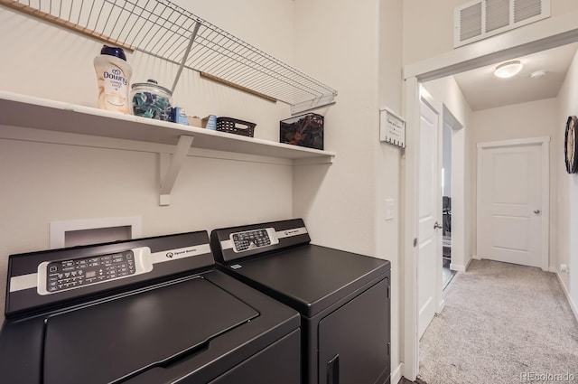 laundry area featuring independent washer and dryer and carpet flooring