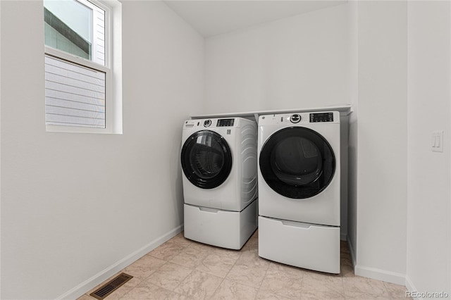 9314 Quartz St, Arvada, CO 80007 - laundry room featuring independent washer and dryer and baseboards
