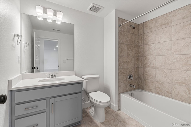 9314 Quartz St, Arvada, CO 80007 - full bathroom with toilet, vanity, tile patterned floors, and tub / shower combination
