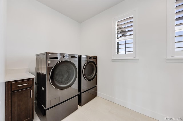 6677 Crossbridge Cir, Castle Pines, CO 80108 - clothes washing area with independent washer and dryer, healthy amount of natural light, and baseboards