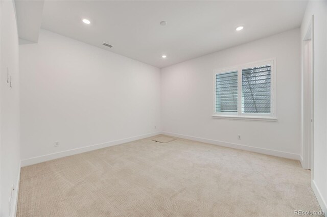 6677 Crossbridge Cir, Castle Pines, CO 80108 - spare room featuring light colored carpet, recessed lighting, and baseboards